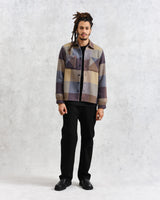 model facing front wearing multi colour square check overshirt