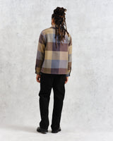 model facing back wearing multi colour square check overshirt